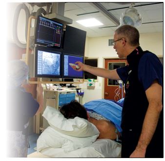 Doctor looking at camera images at the cath lab