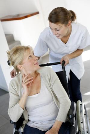 Nurse pushing patient in wheelchair