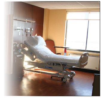 Unoccupied hospital bed in a hospital room